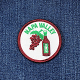 Napa Valley patch with grapes and a bottle on denim fabric