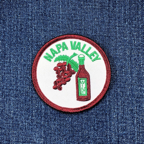 Napa Valley patch with grapes and a bottle on denim fabric