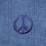 navy blue peace sign patch on a denim background