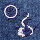 navy blue anchor and ship's wheel patch set on a denim background