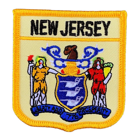 A shield-shaped embroidered patch with the text 'NEW JERSEY' at the top. The patch features an illustration of a figure in a yellow robe, a figure in a red costume, and a blue shield with a lion and unicorn.