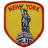 a red and yellow new york statue of liberty patch displayed on a white background