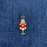 Embroidered nutcracker patch on denim fabric
