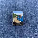 Pin with a scenic Olympic National Park design on a denim background