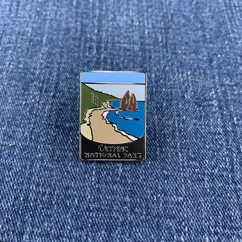 Pin with a scenic Olympic National Park design on a denim background