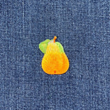 Embroidered pear patch on denim fabric