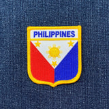 Philippines flag patch on a blue denim background