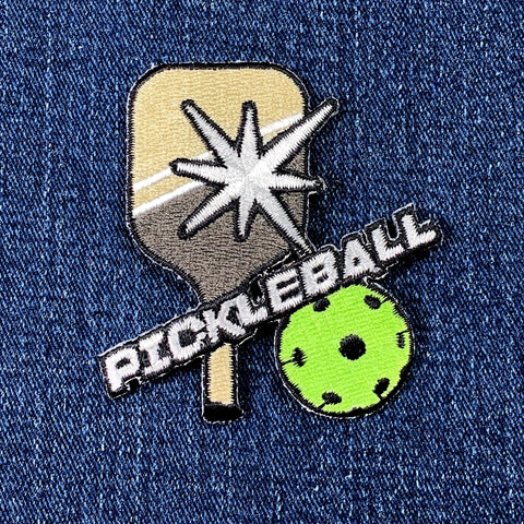 Pickleball paddle and ball patch on denim fabric