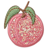 A sparkly pink peach embroidered patch with green leaves and a brown stem, designed as an iron-on badge.