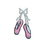 Pink ballet slipper patch with a silver bow on a white background