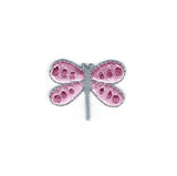 Pink dragonfly-shaped patch on a white background