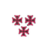 Three pink and black maltese cross patches on a white background
