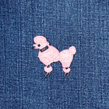 Pink poodle patch on blue denim fabric