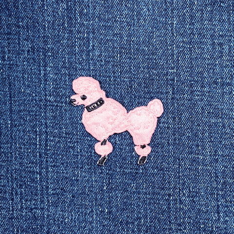 Pink poodle patch on blue denim fabric