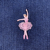 Pink ballerina patch on a denim background