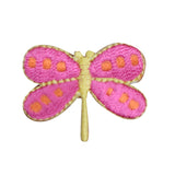 Pink dragonfly-shaped patch with orange spots on a white background