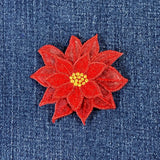 Red flower patch on denim fabric