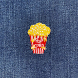 popcorn patch on a denim background