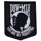 A black and white embroidered patch with 'POW MIA' text and a silhouette of a soldier, with the phrase 'YOU ARE NOT FORGOTTEN' at the bottom.