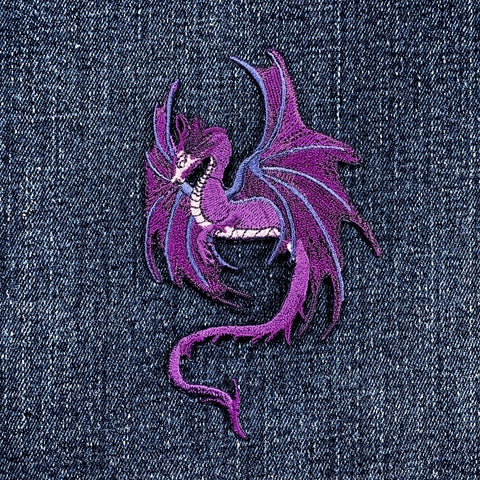 Purple dragon patch on denim fabric