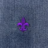 purple fleur de lis patch on a denim background