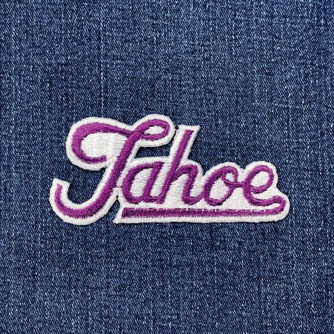 Embroidered 'Tahoe' patch on a denim background