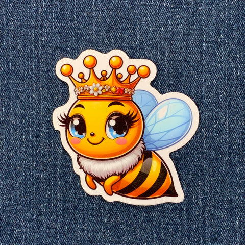queen bee sticker displayed on a denim background
