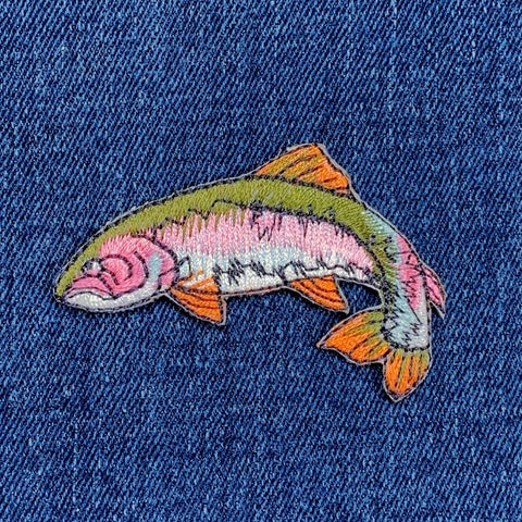 Colorful fish patch on a denim background