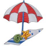 an embroidered red and white beach themed umbrella patch with a towel and seashells below