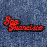 Embroidered patch with 'San Francisco' text on denim fabric