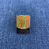 Pin with redwood national park design on a blue denim background