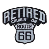 An embroidered patch with the text 'RETIRED CRUISIN' ON ROUTE 66' on a black background, with a white border and a graphic of a Route 66 road sign.