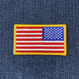 Reverse American flag patch on a denim background