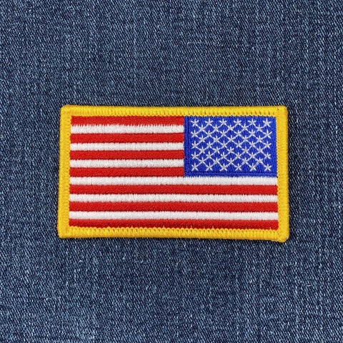 Reverse American flag patch on a denim background
