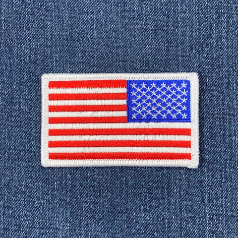 Reverse American flag patch on a denim background