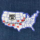 Map of the United States with Route 66 highlighted on a denim background
