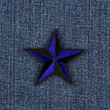 royal blue 3-D star patch on a denim background