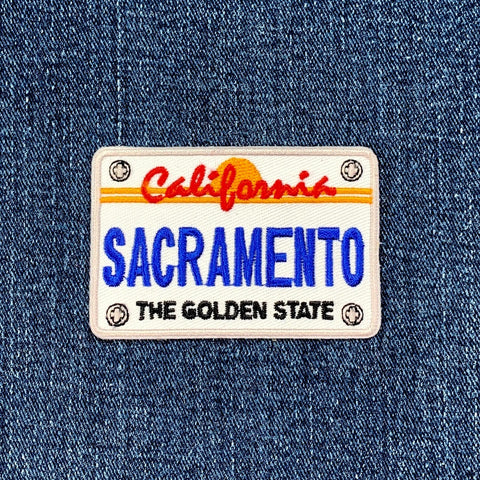 Embroidered patch on denim fabric with 'California Sacramento' text