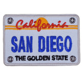 An embroidered patch in the shape of a California license plate with 'San Diego' text and 'The Golden State' slogan.
