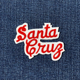 Embroidered 'Santa Cruz' patch on denim fabric