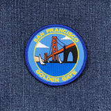 A round embroidered patch featuring the Golden Gate Bridge with the text 'San Francisco' and 'Golden Gate' on a blue and white border.