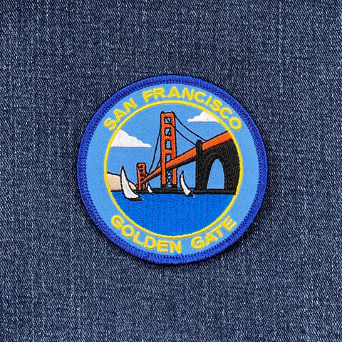 A round embroidered patch featuring the Golden Gate Bridge with the text 'San Francisco' and 'Golden Gate' on a blue and white border.