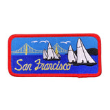 Embroidered patch of San Francisco Bay with sailboats and the Golden Gate Bridge on a white background.