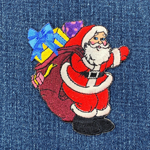Embroidered patch of Santa Claus on denim fabric
