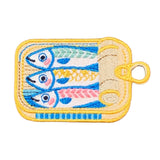Embroidered patch of sardines in a can on a white background