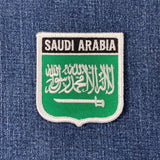 Embroidered patch of Saudi Arabia flag on a denim background