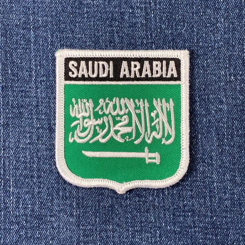 Embroidered patch of Saudi Arabia flag on a denim background