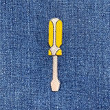 Screwdriver-shaped patch on denim fabric