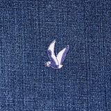 Small seagull patch on a denim fabric background