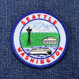 Embroidered patch with Seattle, Washington design on denim fabric